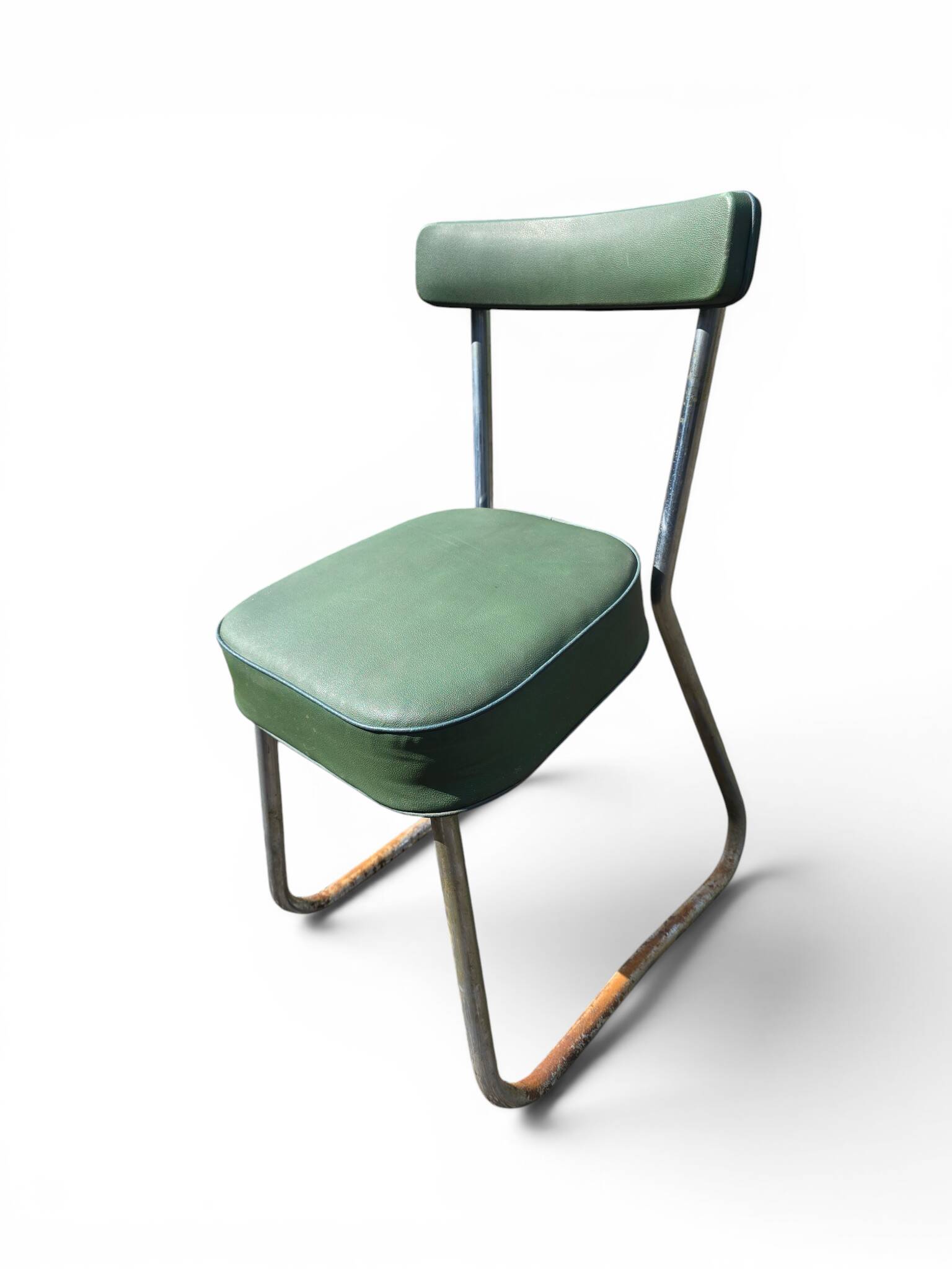 Vintage green faux leather chair with metal frame, 1960s.