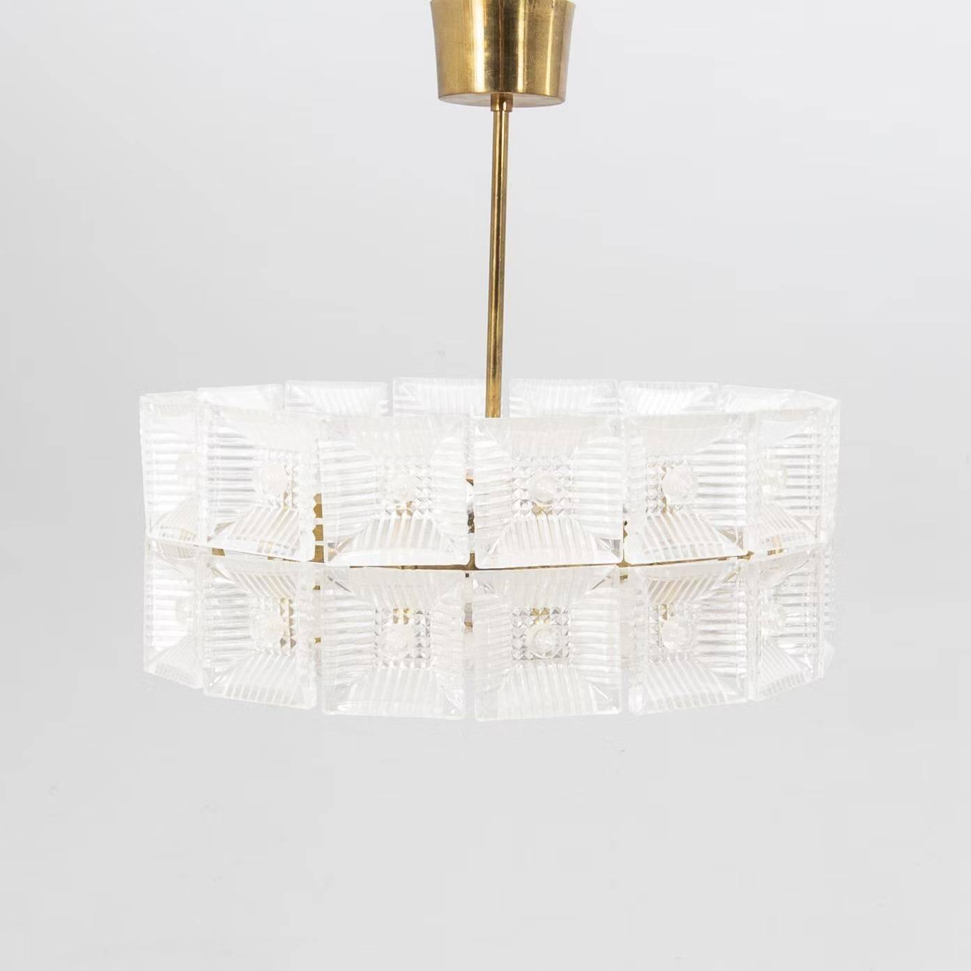 Suspended glass and brass lamp by Carl Fagerlund for Orrefors, Sweden, 1960.