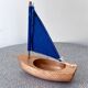 Small navigable pond sailboat made of wood and cotton, in good condition.