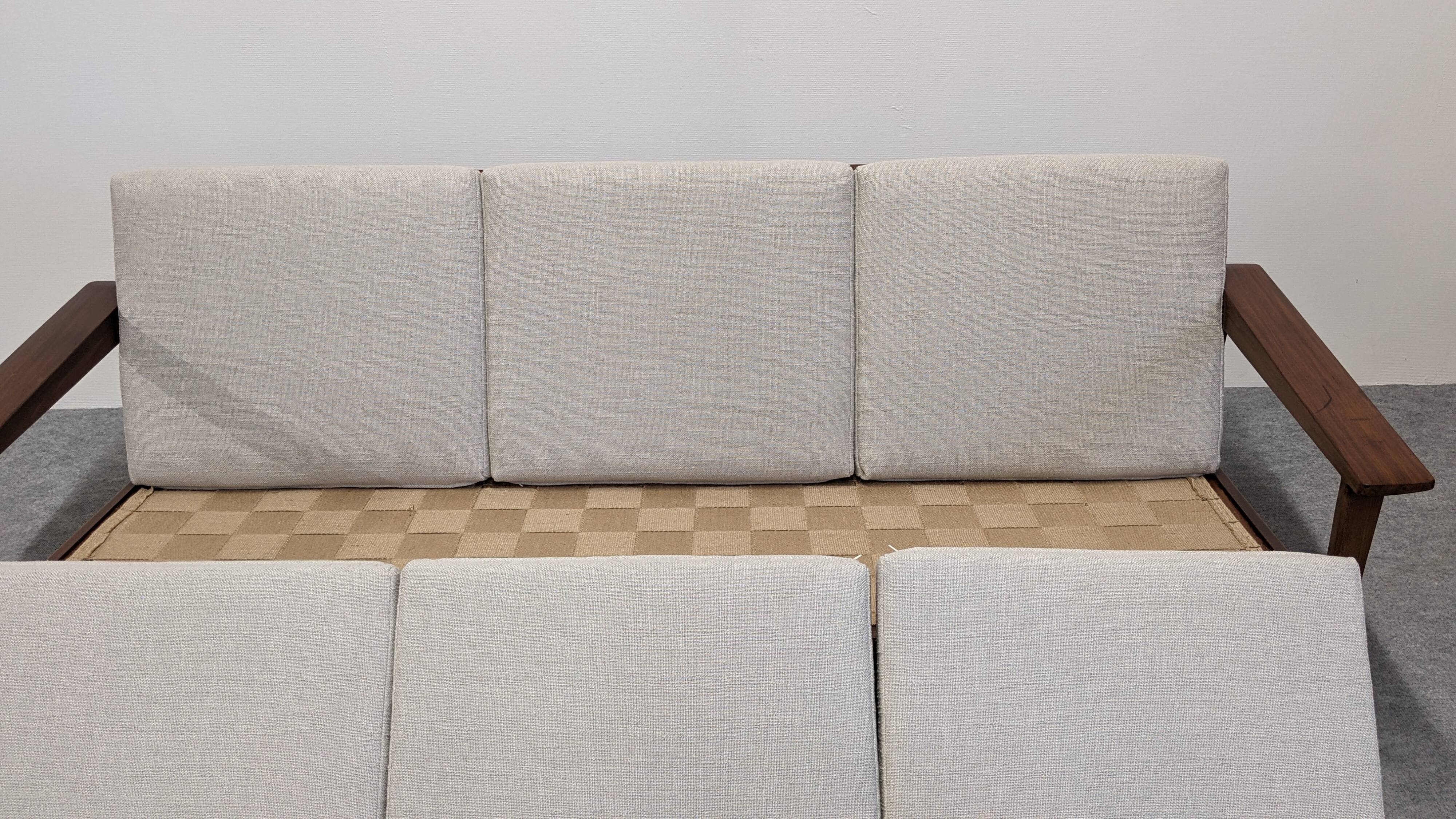 Scandinavian style three-seater sofa in teak, France circa 1950.