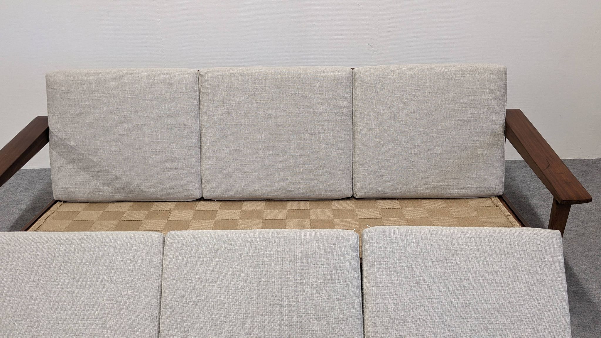 Scandinavian style three-seater sofa in teak, France circa 1950.