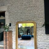 Antique mirror 136.5/98cm Louis-Philippe pearl-gilded with gold leaf.