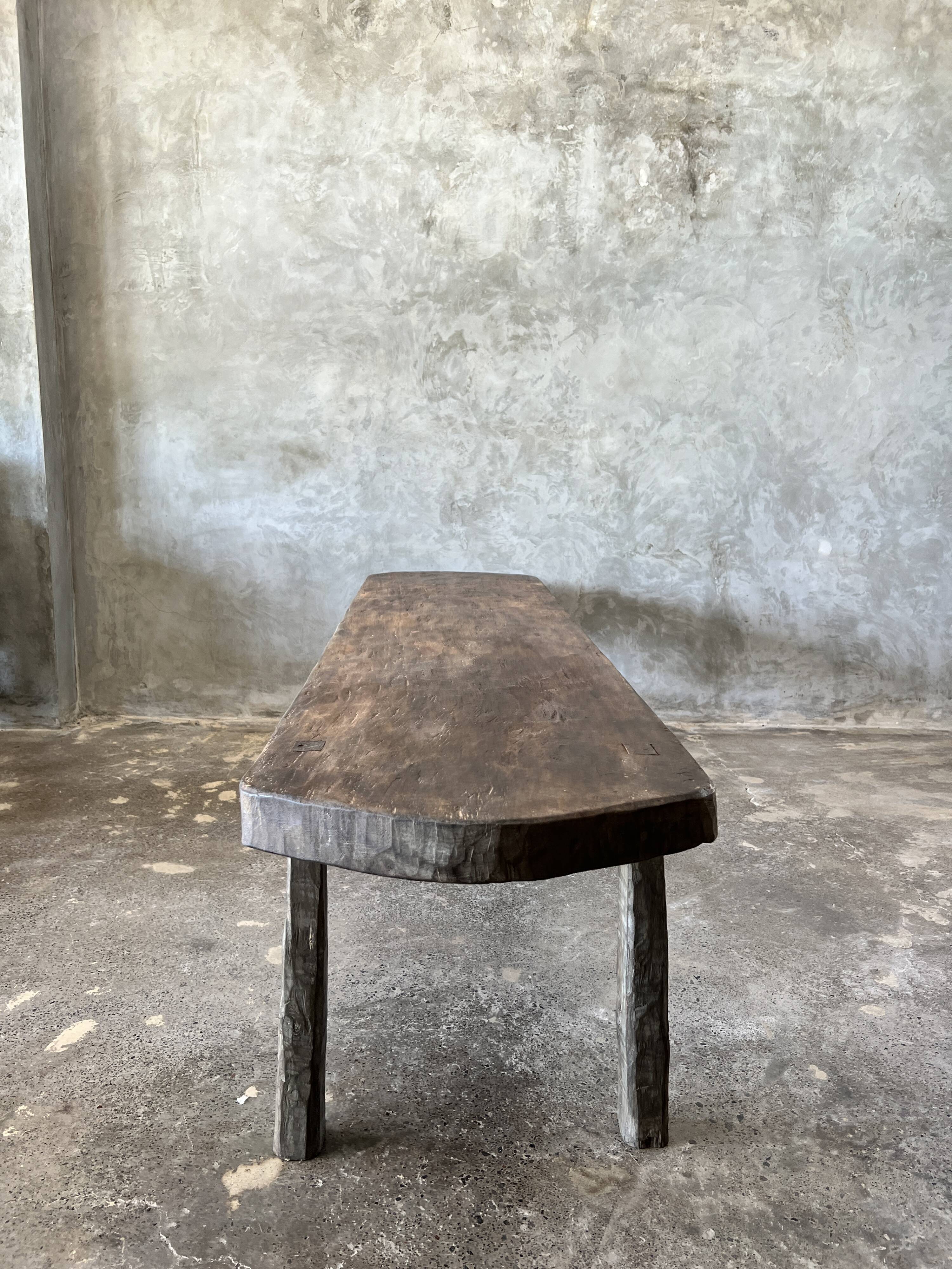 Large rounded coffee table in old Asian teak