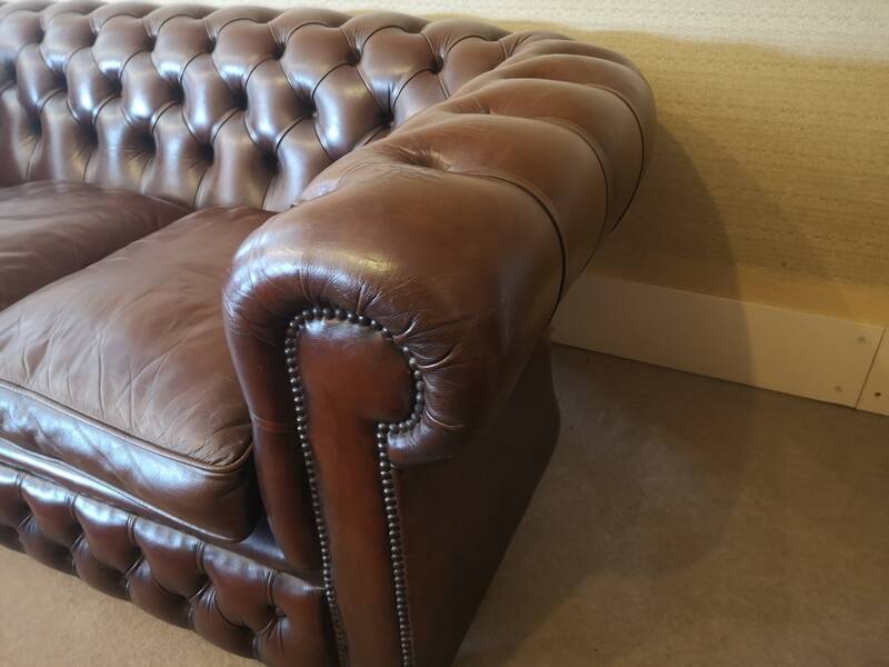 Vintage three-seater brown leather Chesterfield sofa