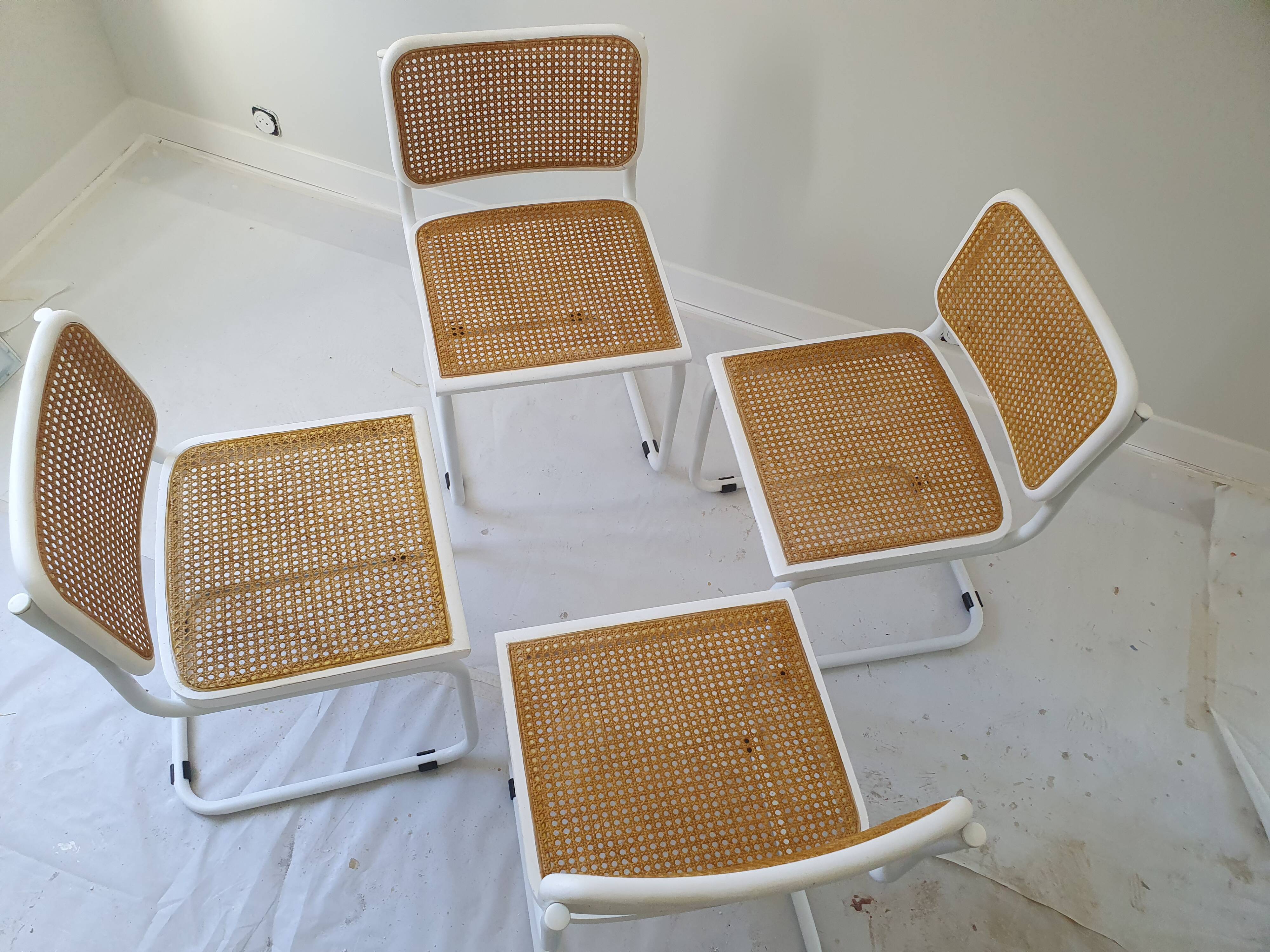 B32 chairs by Marcel Breuer in white.
