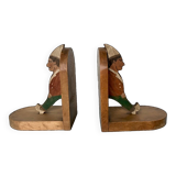 Old wooden bookends with painted characters