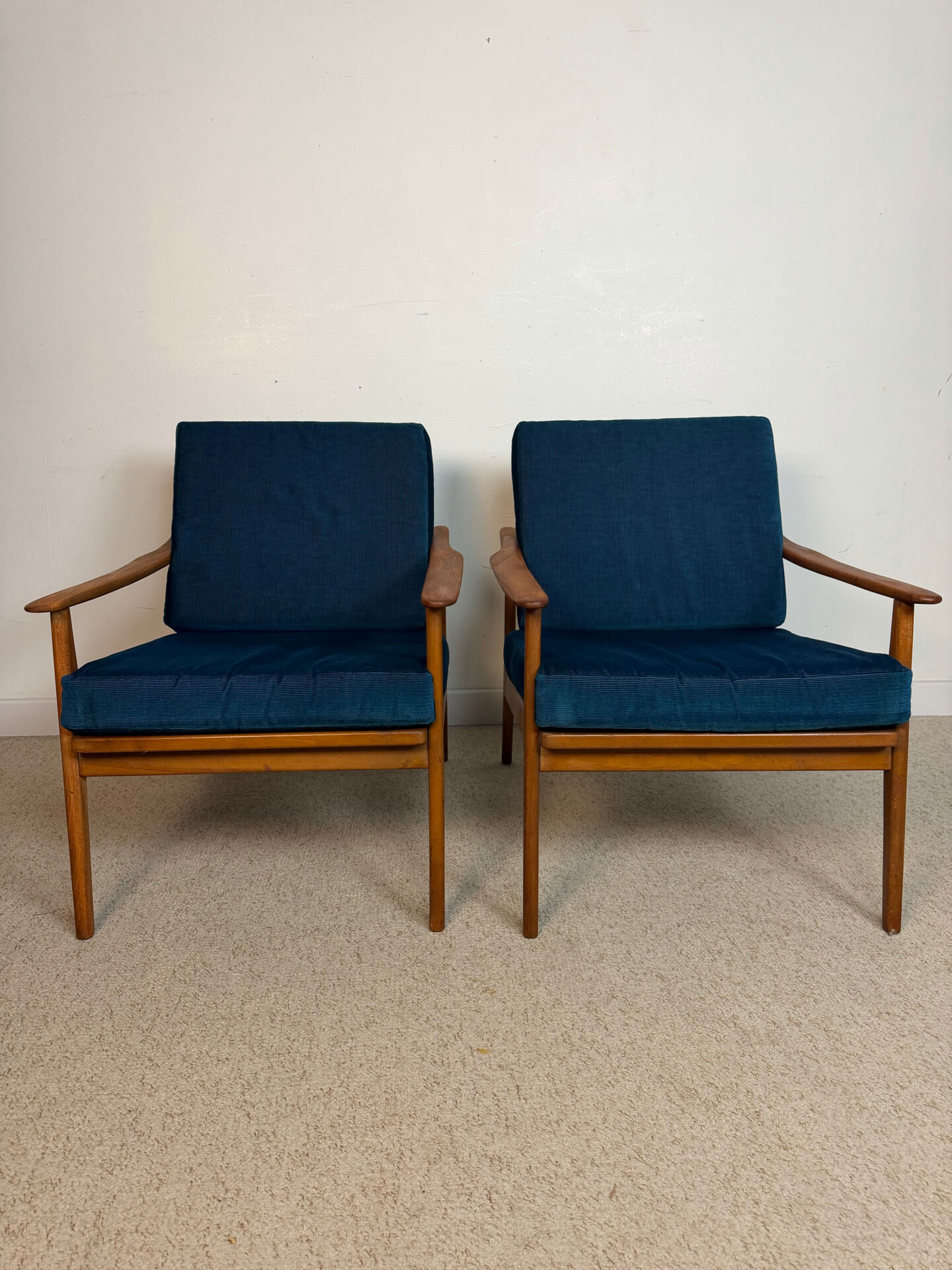 a pair of Scandinavian armchairs in teak from the 1960s