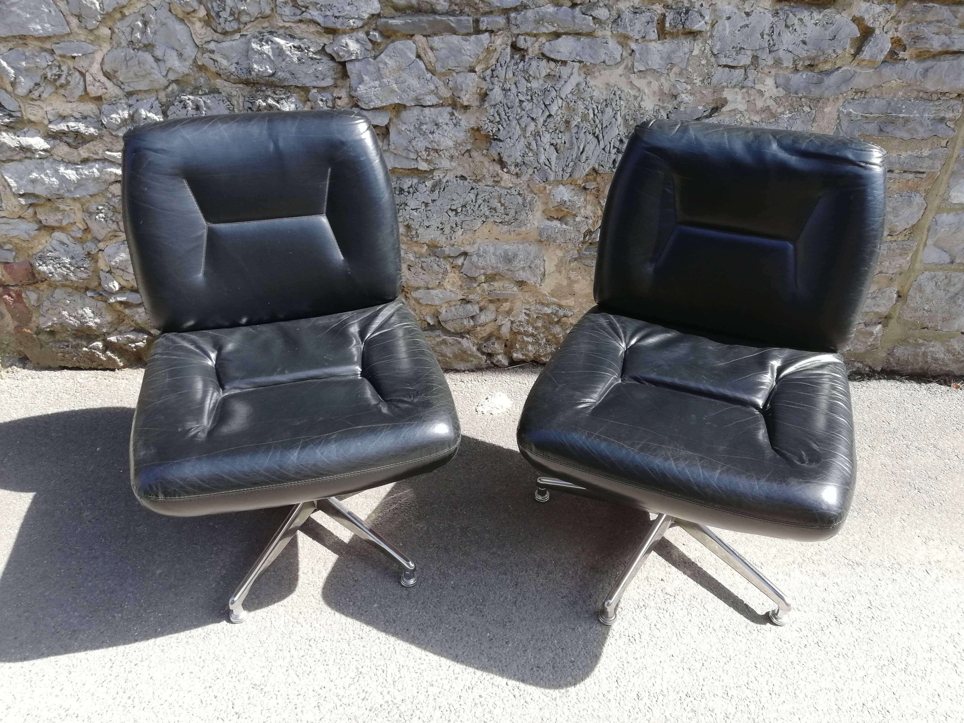 Pair of black leather office armchairs, 1970