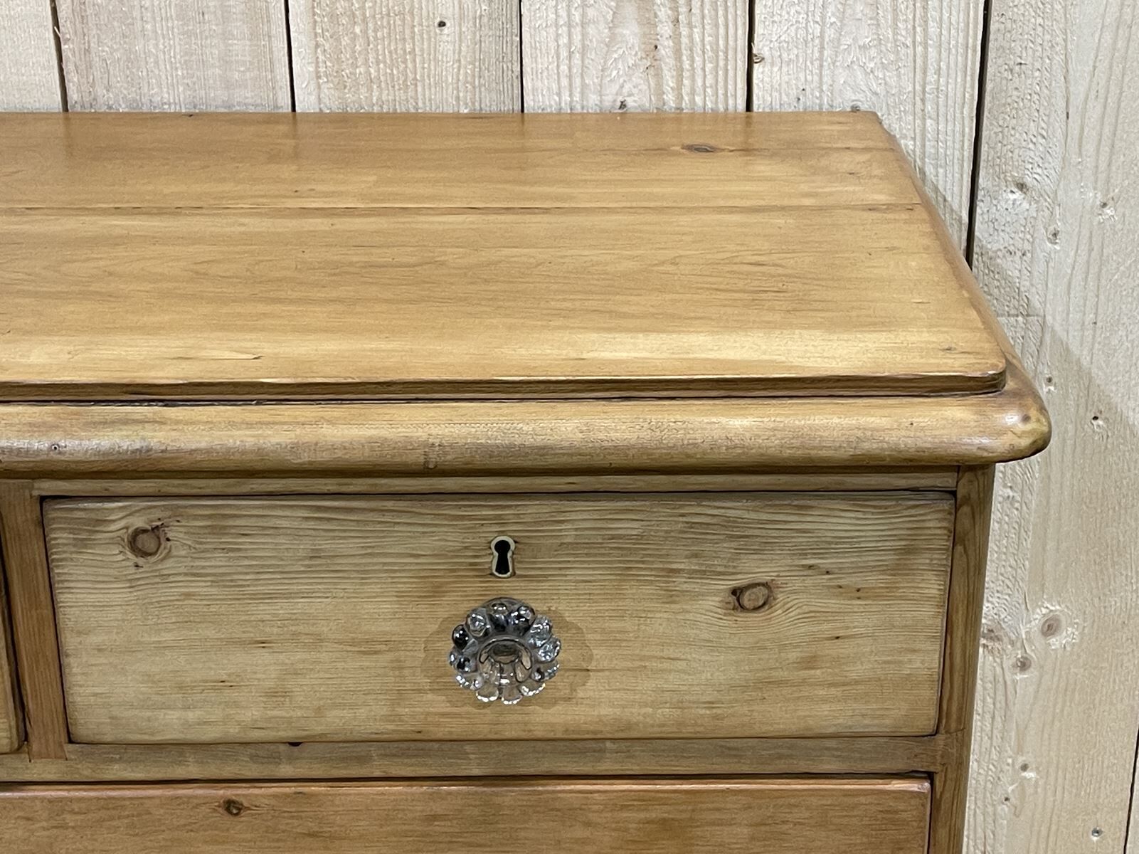 English chest of drawers in nineteenth century fir with its glass buttons