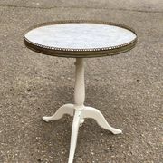 Pair of marble and ivory tripod pedestal tables