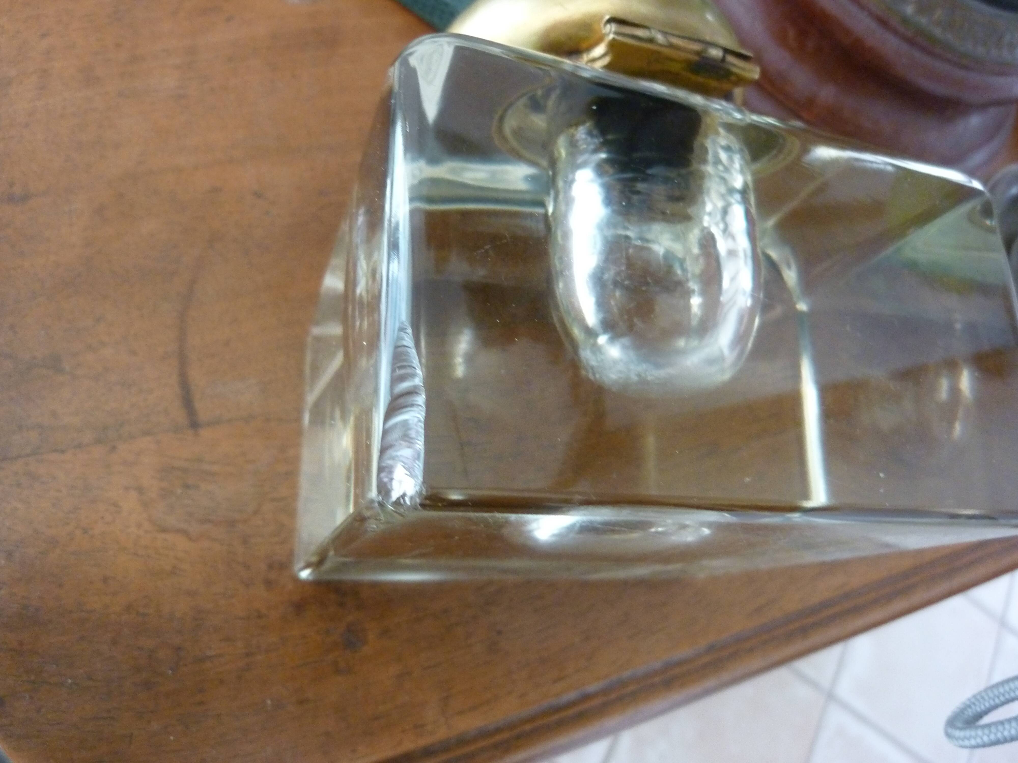 Old and imposing thick glass desk inkwell, gold brass lid