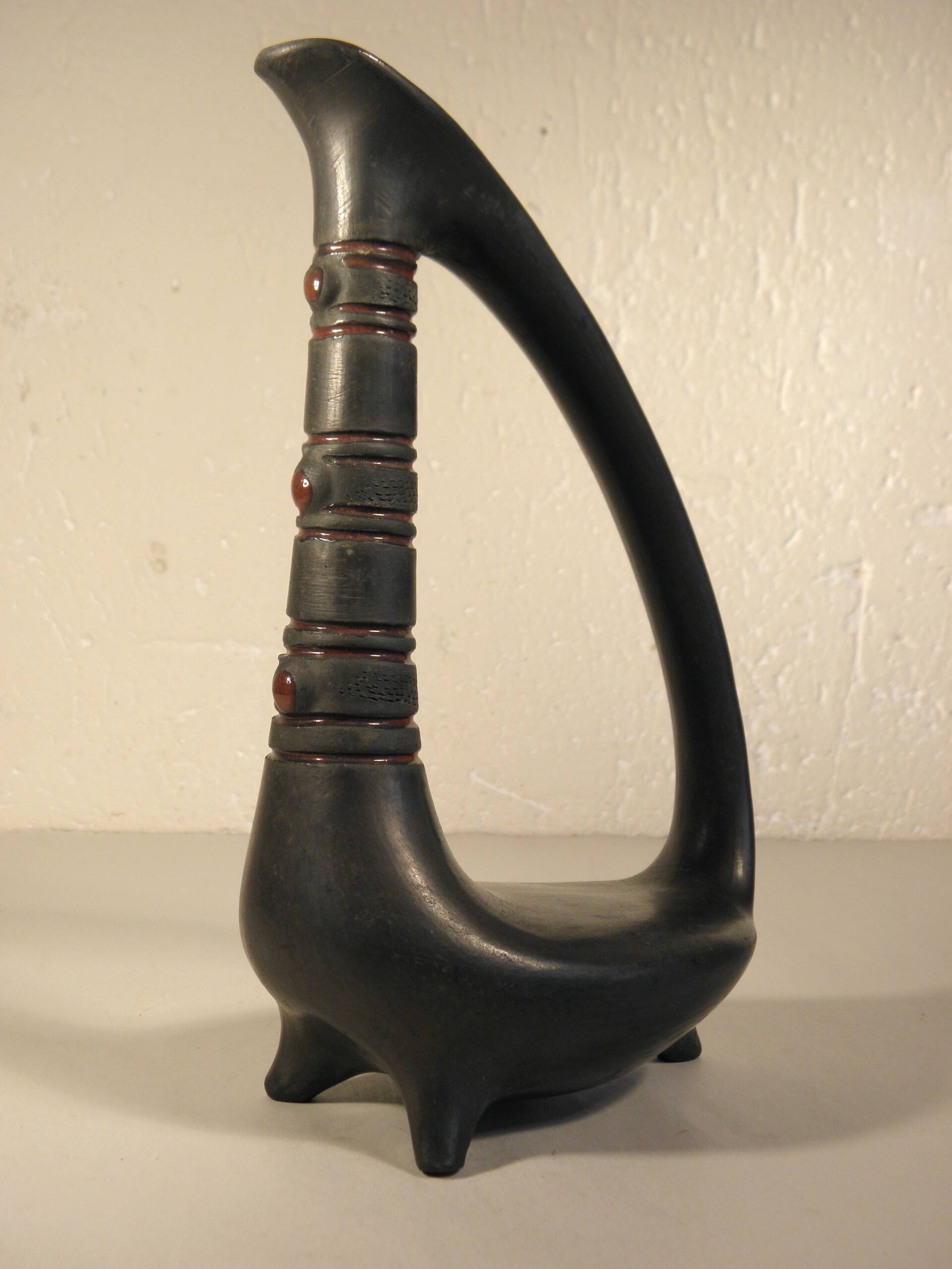 Zoomorphic pitcher vase in black ceramic