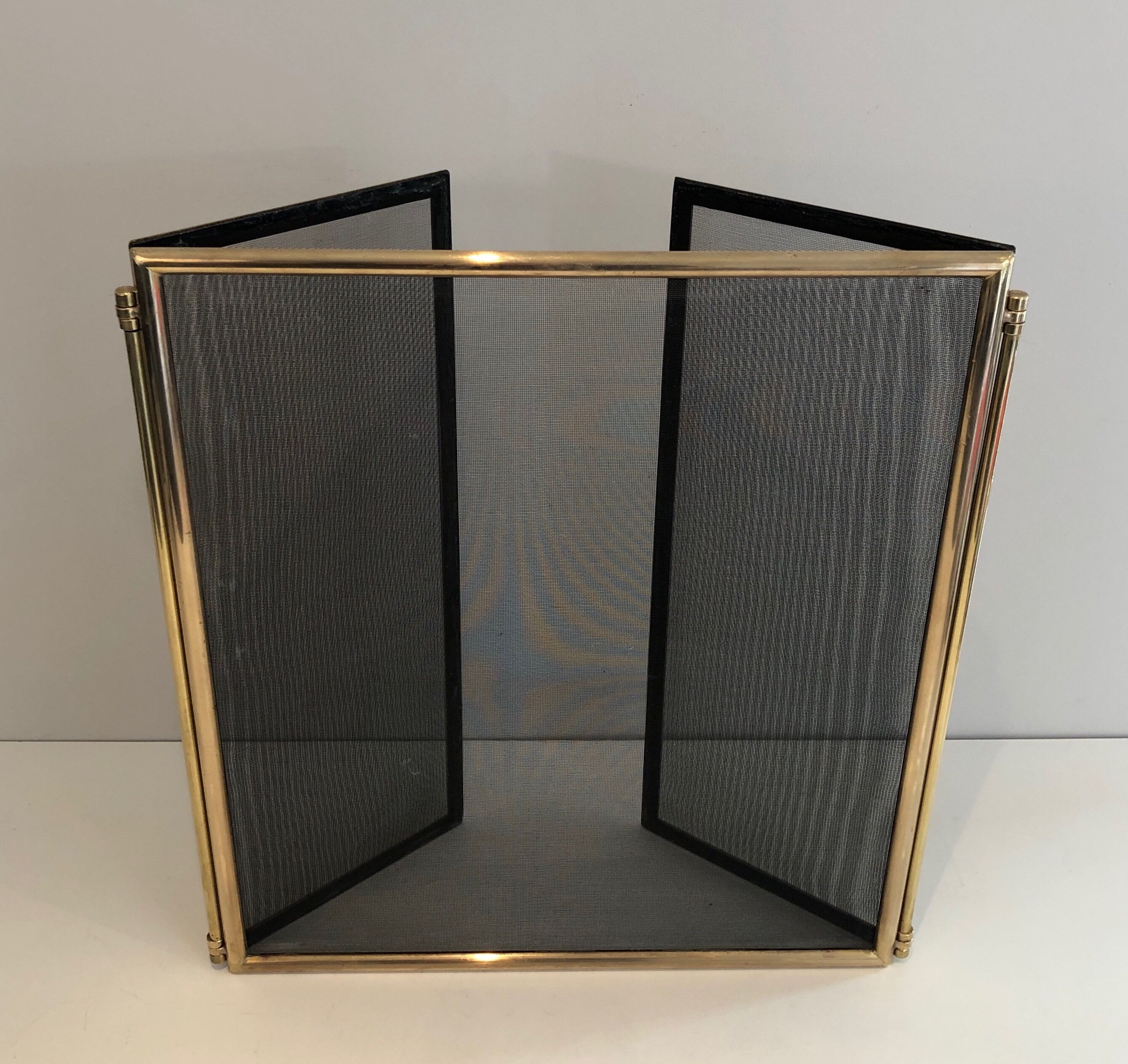 Brass and wire mesh firewall. french work. around 1970