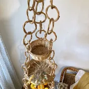 Large wicker suspension with three baskets, twisted ring chain.