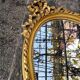 Miroir en bois ovale et doré style rococo 42x73cm