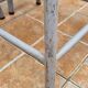Set of four stackable industrial tubular metal and wood stools