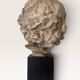 Plaster bust on a wooden base