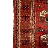 Red wool carpet, geometric pattern.