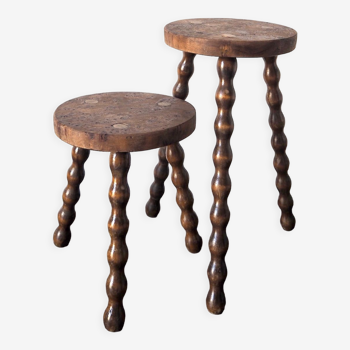Duo of tripod stools in walnut bramble