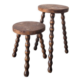 Duo of tripod stools in walnut bramble
