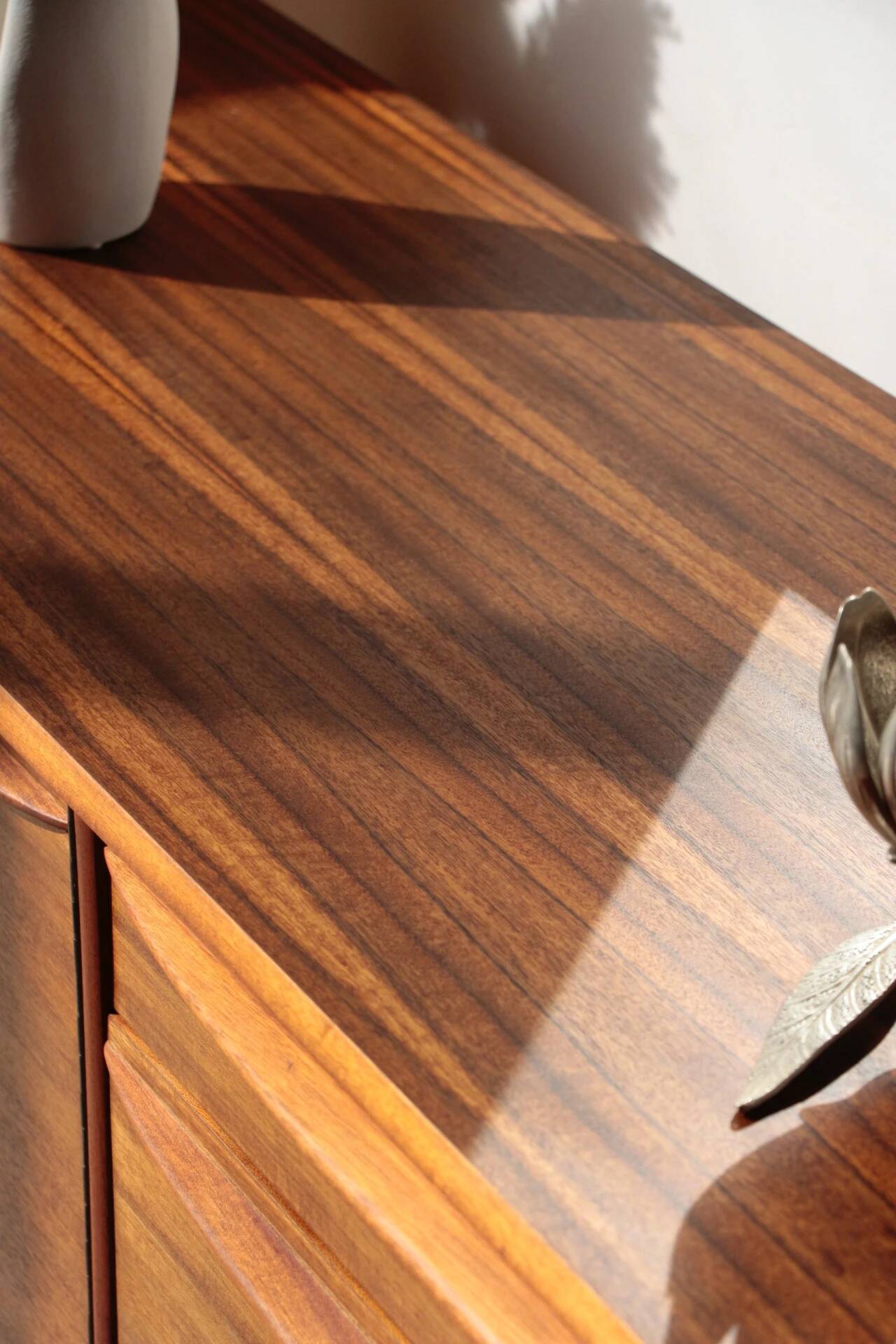 Vintage zebrano and walnut furniture from Morris of Glasgow.