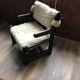 Set of 2 vintage wooden chairs with beige sheepskin seats, rustic style.