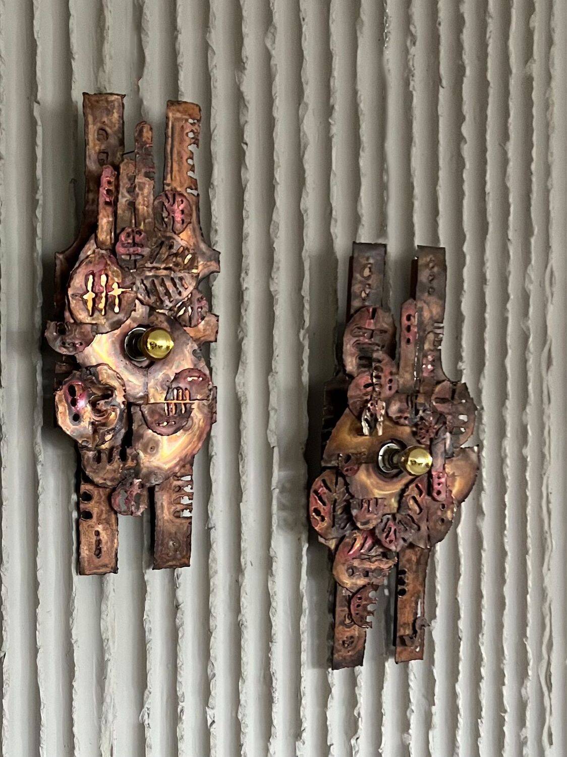 Set of raw expressive wall sconces by Francesco Pasinato