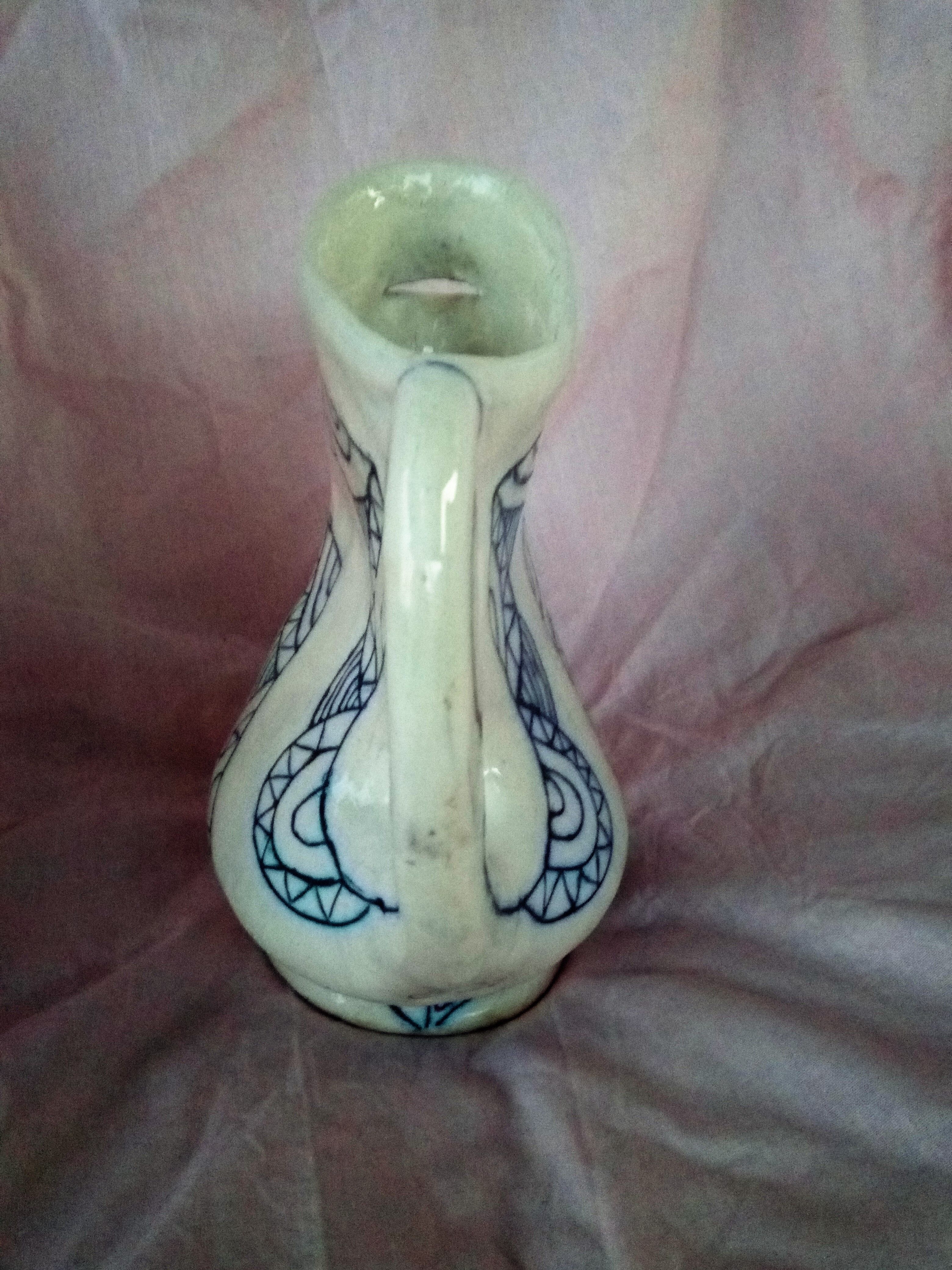 Zoomorphic pitcher in enamelled terracotta