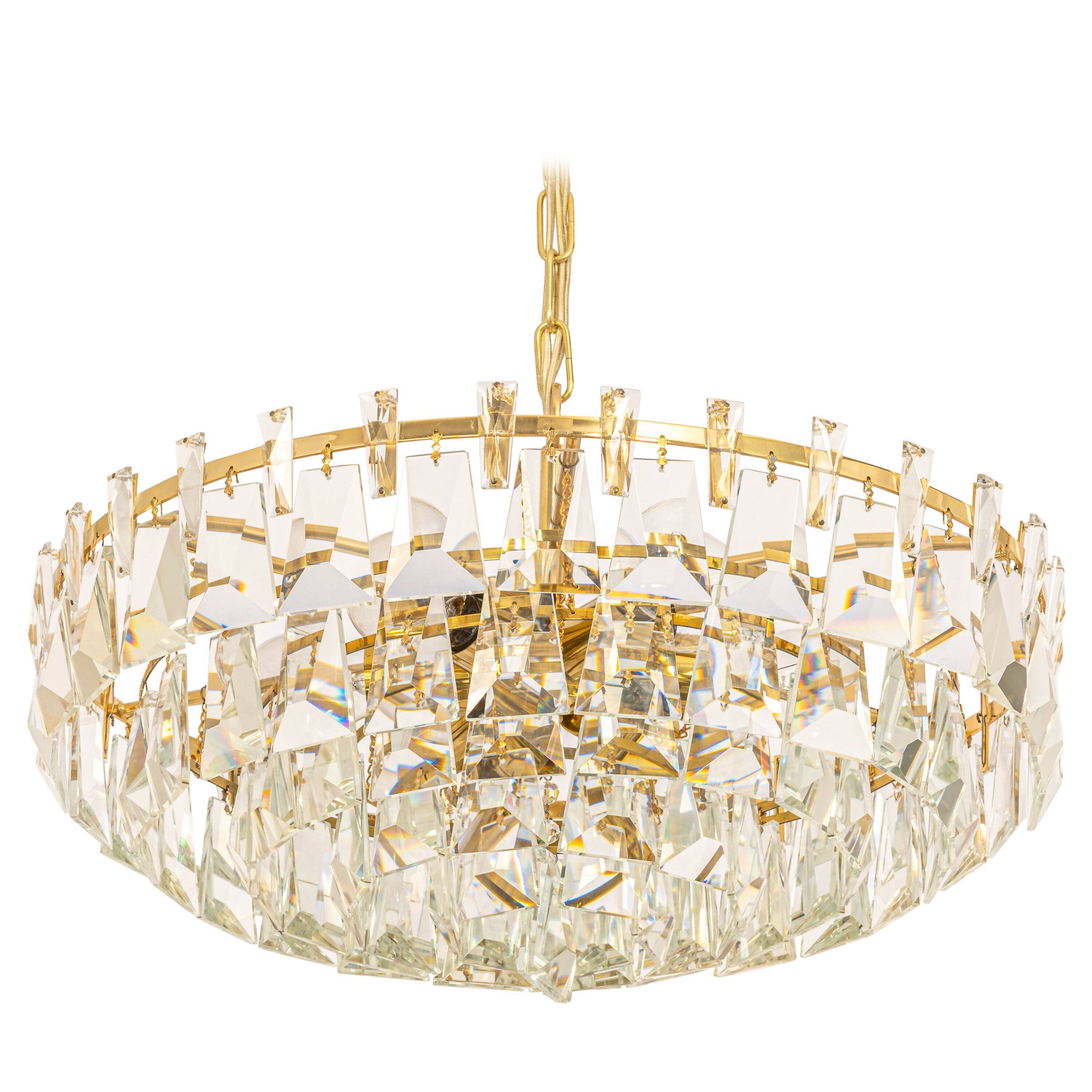 Large chandelier in gilded brass and crystal, by Palwa, Germany, 1970s.