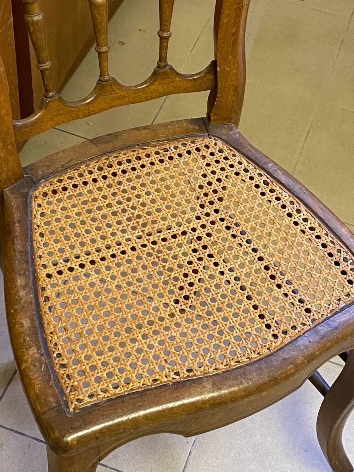 Antique wooden chair, cane seat