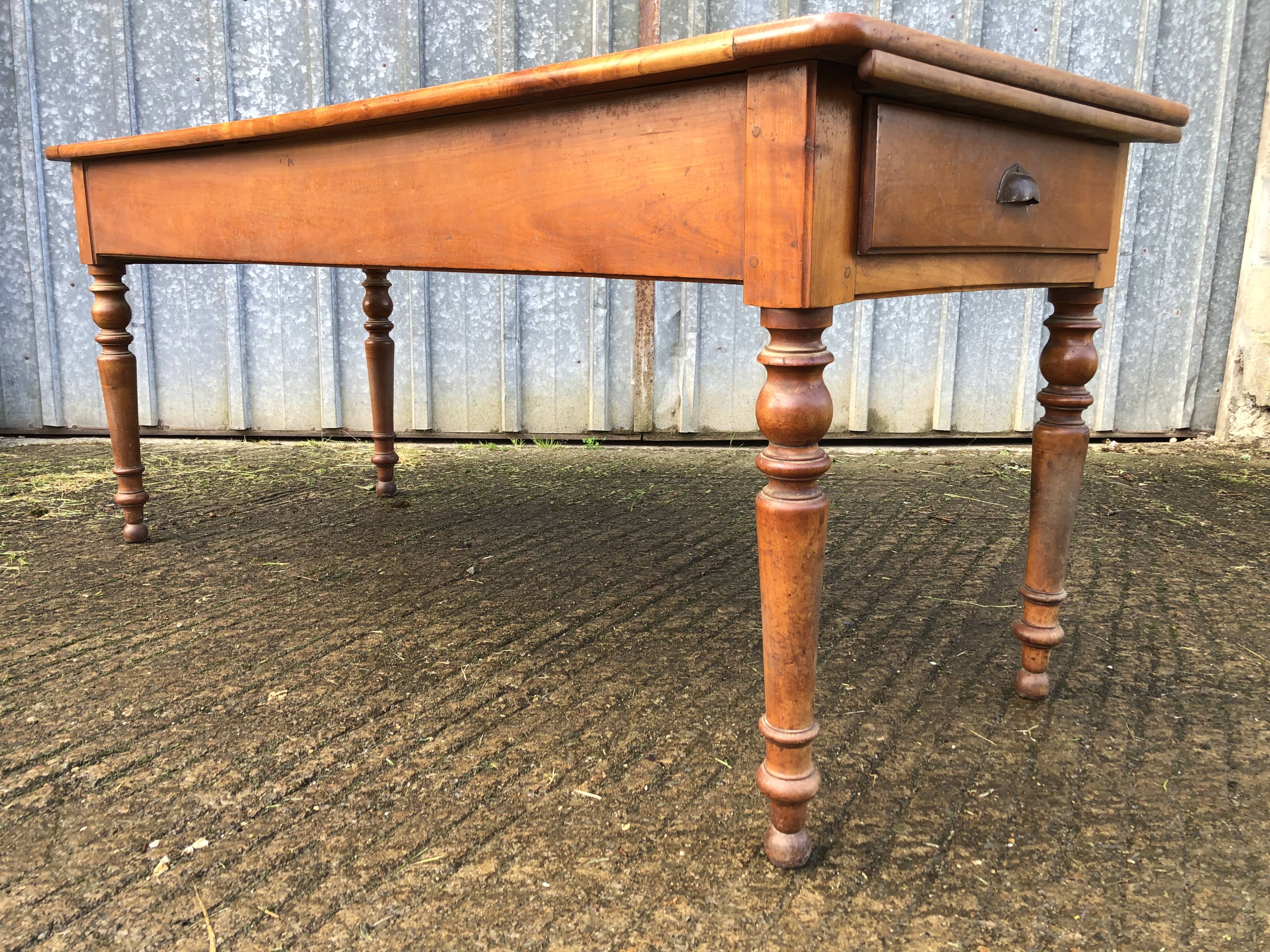 Antique farmhouse table in solid cherry wood in Louis Philippe style.