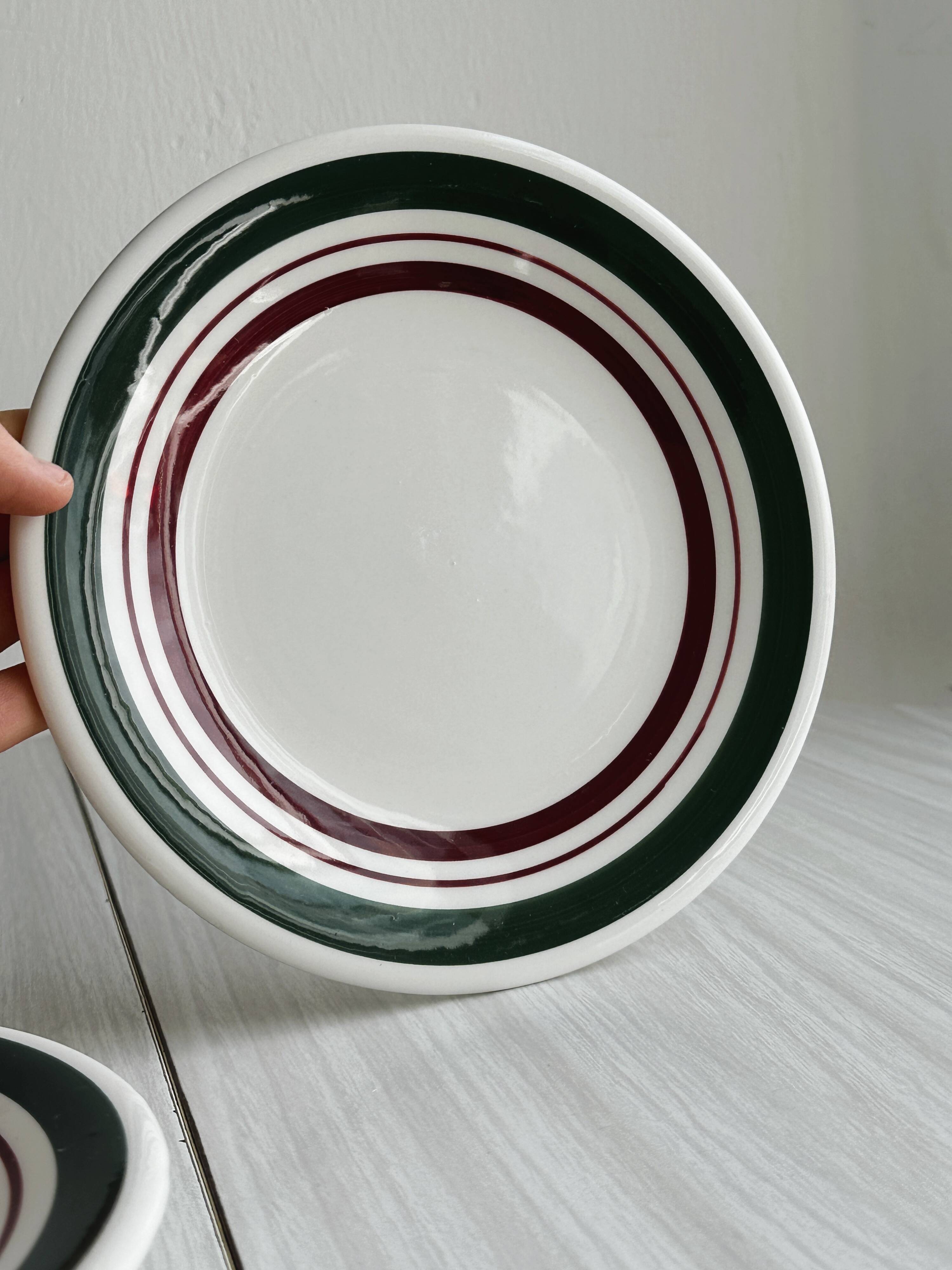 2 green and burgundy strip dessert plates.