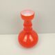 Orange glass vase and white interior
