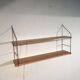 String shelf 1950
