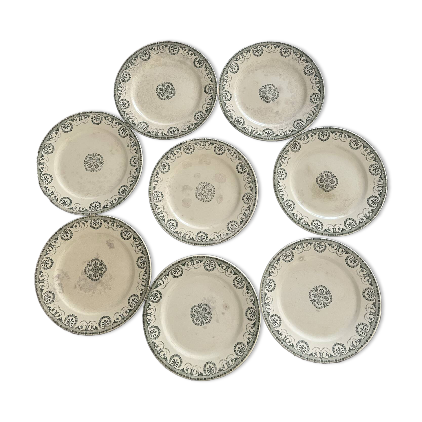 Set of 8 flat plates made of ironstone.