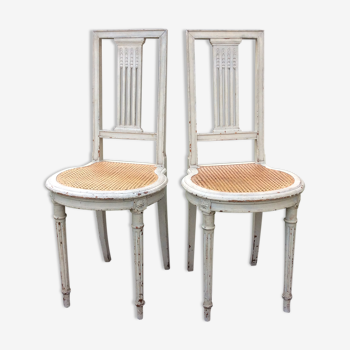 2 chaises raquettes de style Louis XVI laquées gris cannelage
