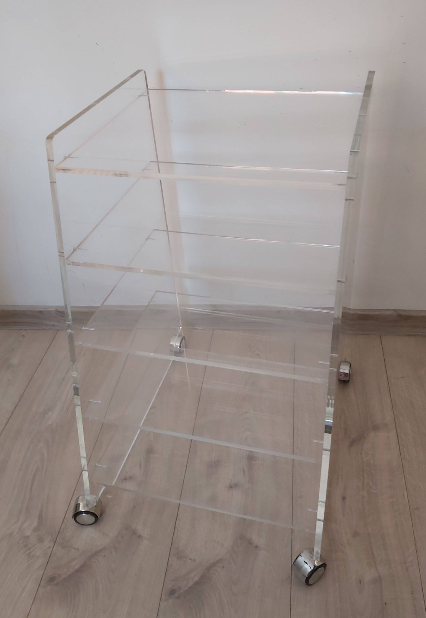 Lucite mobile shelf, 1970s.
