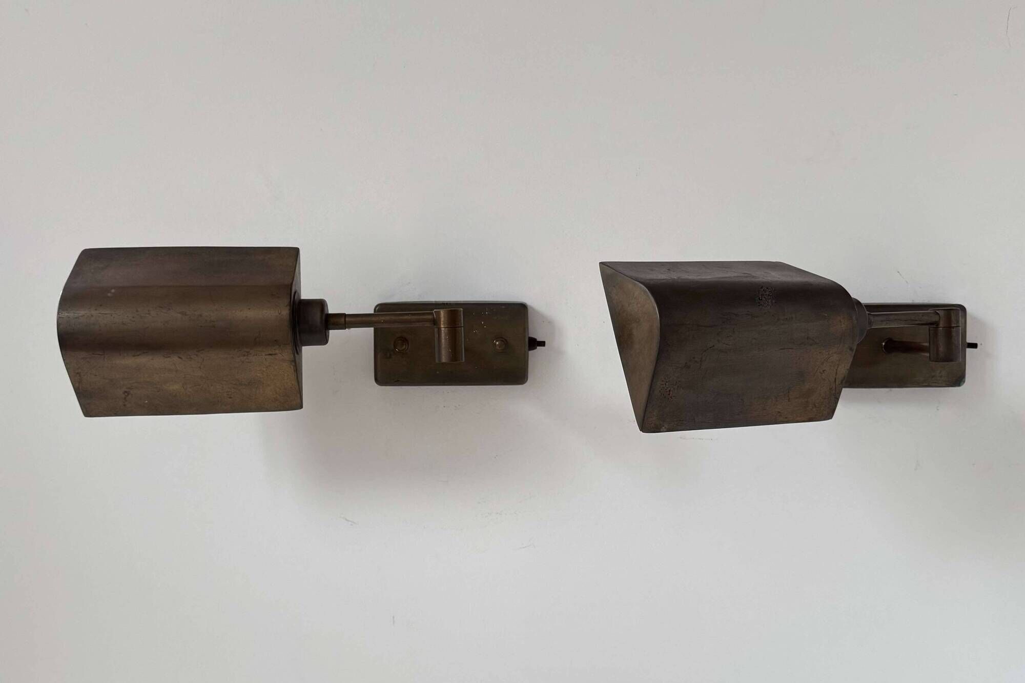 Pair of vintage adjustable wall lights, patinated brass, France 1970.