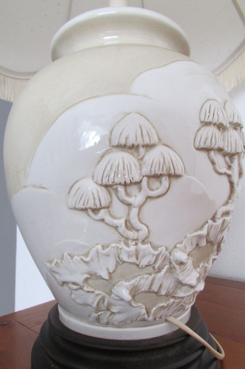 Pair of relief enameled porcelain lamps, Asian motif