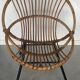 Fauteuil coquille en rotin - piétement tubulaire métallique noir - 1960