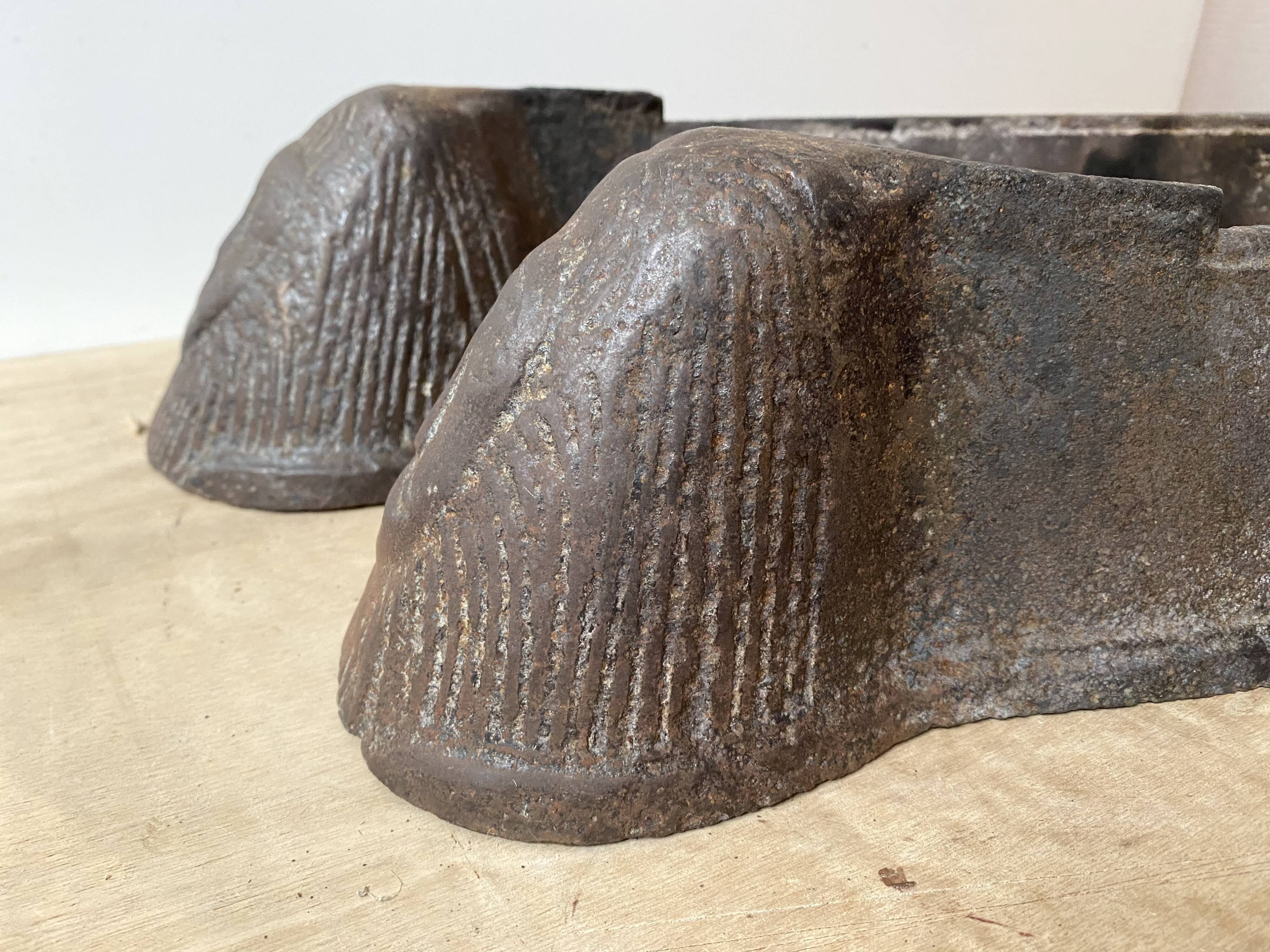 Pair of modernist anthropomorphic fireplace andirons, brutalist log holders 1950s