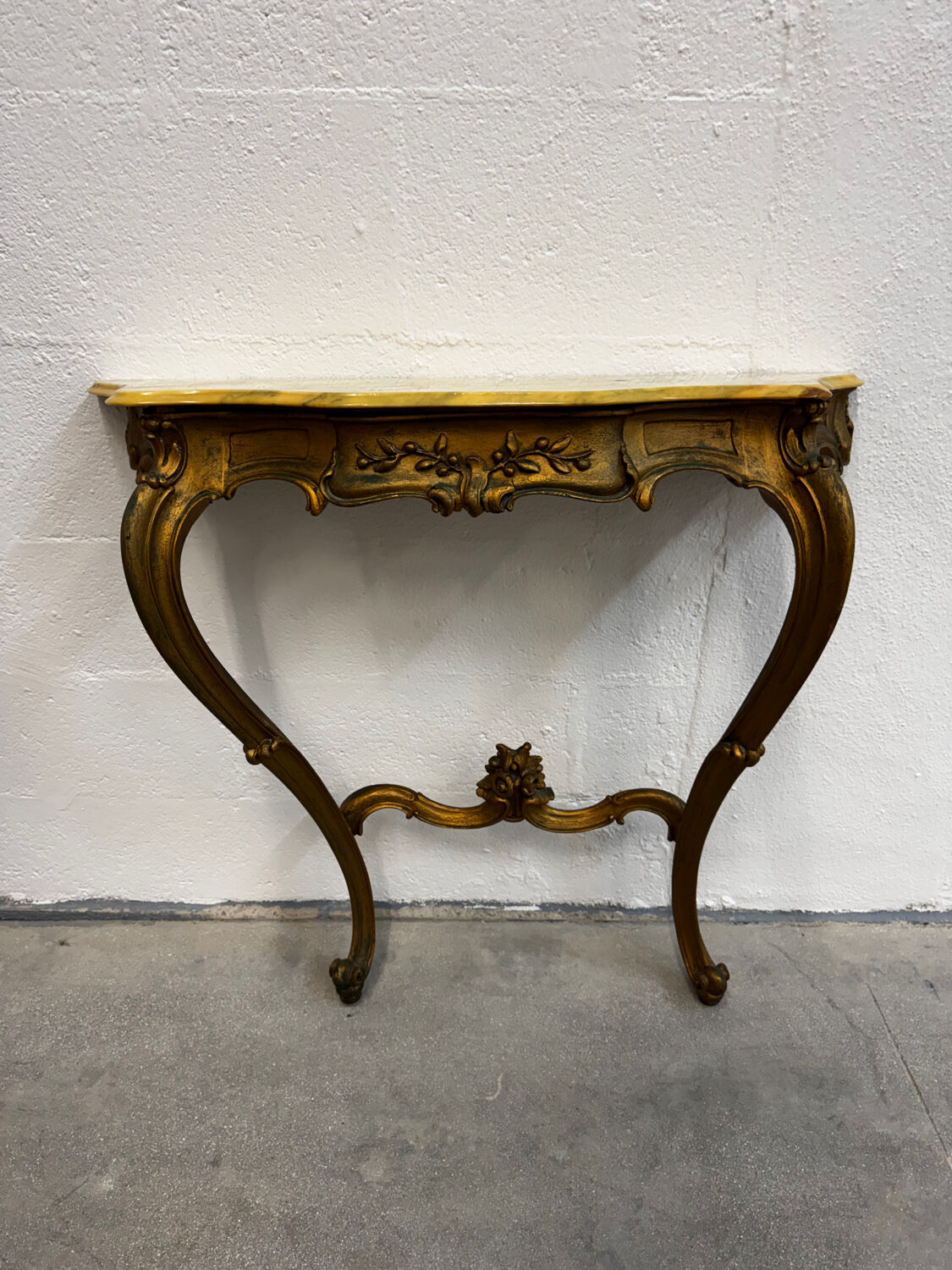 Carved gilded wooden console and marble in Louis XV style
