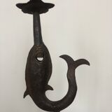 Old and patinated metal candlestick
