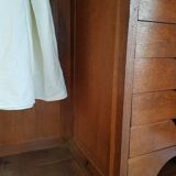 Old black wardrobe - wooden drawers and labels of origin