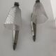 Silver Art Deco wall lights with frosted glass.