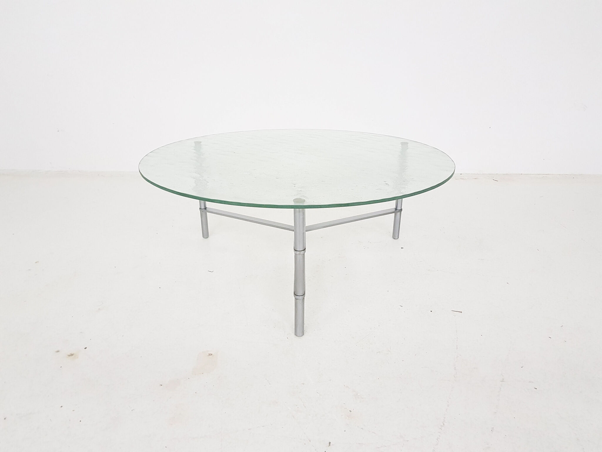 Mid-century round glass and chrome coffee table