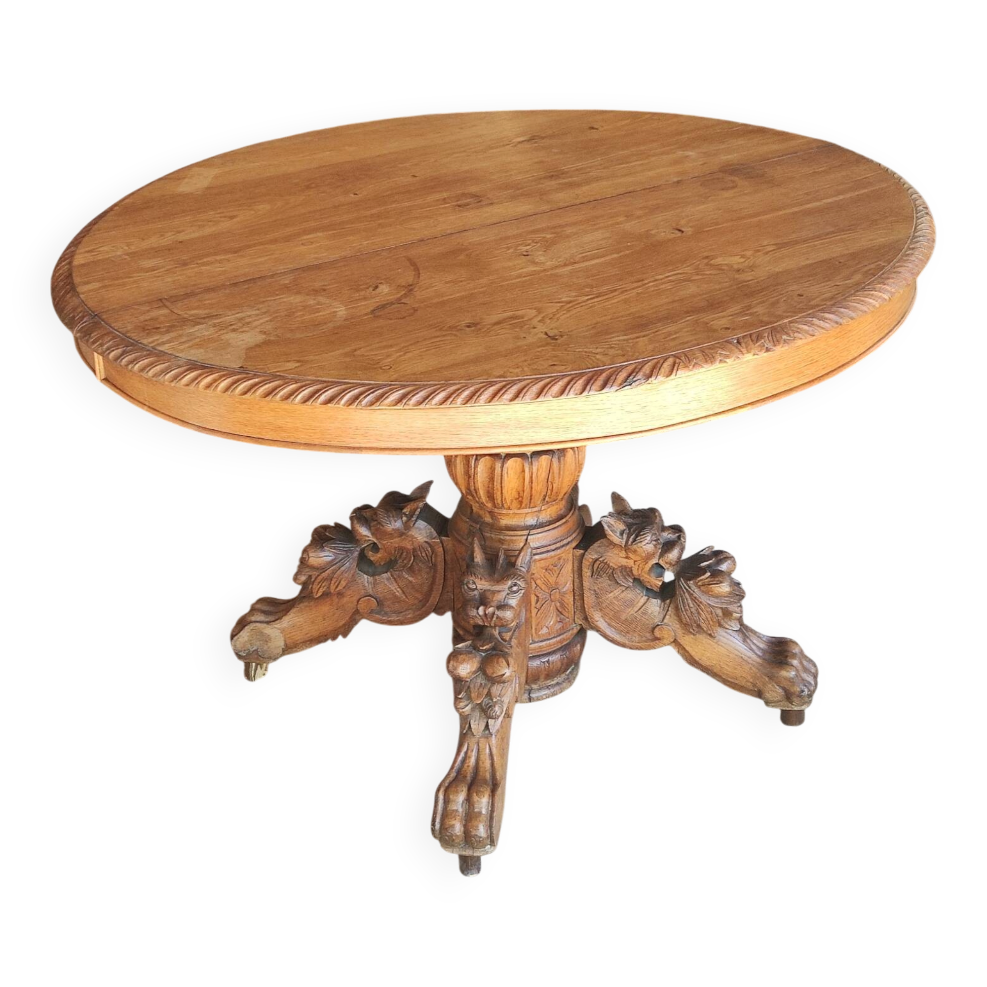 Oval oak table with carved details - known as a hunting table.
