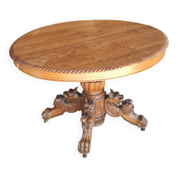 Table ovale en chêne blond sculpté - dite table de chasse