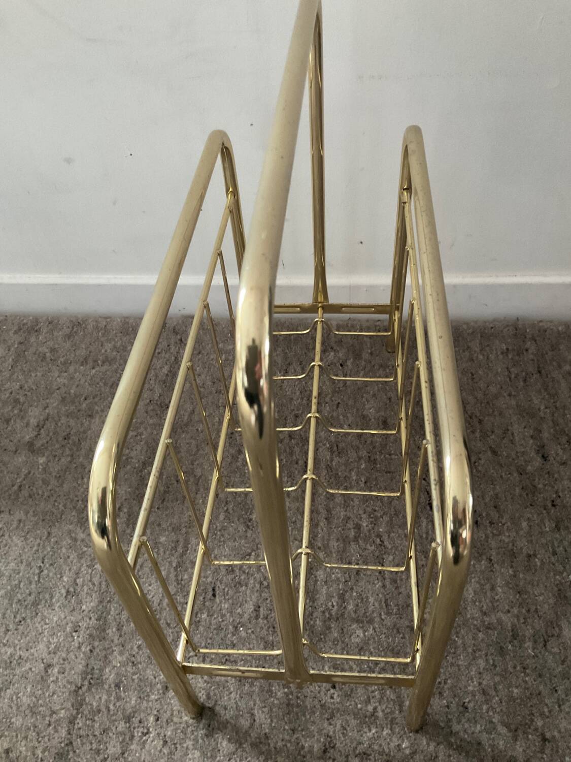 Vintage magazine holder in gold metal