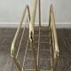 Vintage magazine holder in gold metal